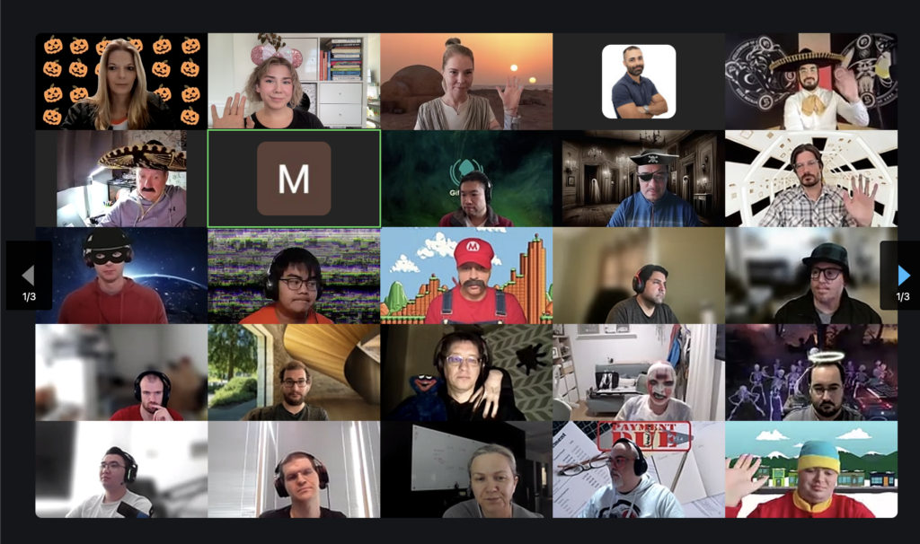 A Zoom gallery view of GitKraken team members during a virtual meeting, many wearing costumes or using themed virtual backgrounds, celebrating a festive occasion, possibly Halloween.